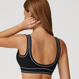 Top deportivo Impact de Admyre, diseño seamless con soporte cómodo y ajuste envolvente