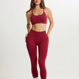 Legging Admyre Moonlight rojo de cintura alta con efecto moldeador y tejido técnico elástico para entrenamiento.