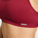 Top deportivo Admyre Moonlight rojo con diseño de sujeción media, tejido transpirable y estilo athleisure.