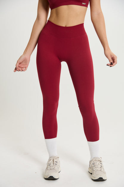 Legging Admyre Moonlight rojo de cintura alta con efecto moldeador y tejido técnico elástico para entrenamiento.