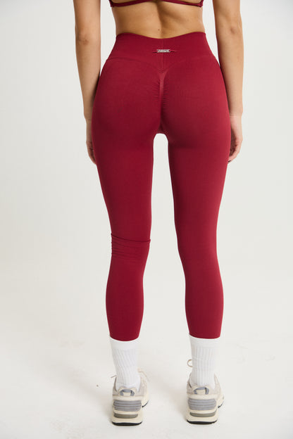 Legging Admyre Moonlight rojo de cintura alta con efecto moldeador y tejido técnico elástico para entrenamiento.