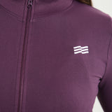 Chaqueta Admyre Moonlight morada con fit ceñido, tejido elástico y cremallera frontal, perfecta para el gym o streetwear.