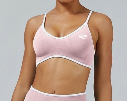 Top deportivo bicolor de Admyre con líneas blancas, diseño seamless y ajuste de soporte